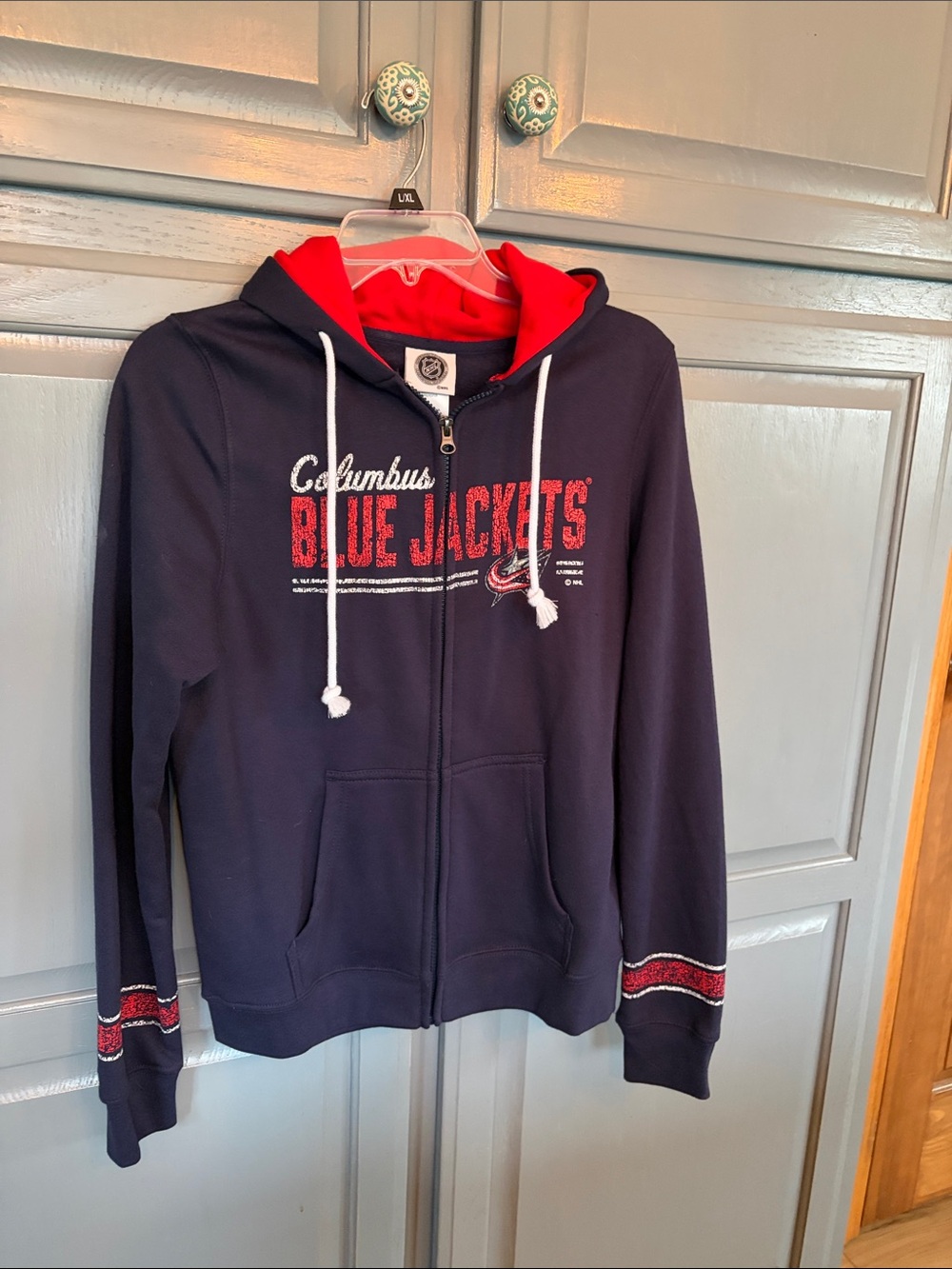 NHL Columbus Blue Jackets Navy Zip Hoodie with Red Lining. Never worn
